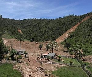 At least 13 die in Bolivia as landslide sweeps away two buses