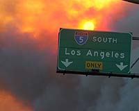 California ramps up battle against two dozen wildfires