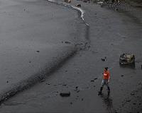 Brazil races to clean up oil-stained beaches before peak tourism season