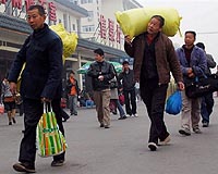 China promises to remove urban-rural registration divide