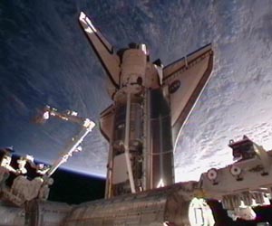 Full house at space station as Discovery docks