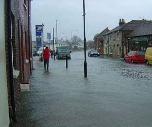 Woman dies as hundreds flee homes in flooded Welsh city