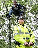 Sitting On The Fence: G8 Protester Answers Nature's Call