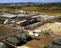 At Guantanamo, prisoners watch parade of US military guards go by