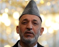 Afghan leader demands air strikes end