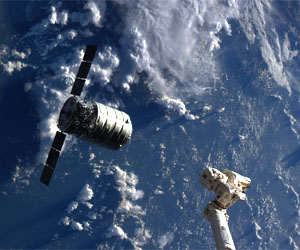 Unmanned cargo ship docks with orbiting Space Station