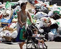 Naples 'submerged' under rubbish despite Berlusconi visit: paper