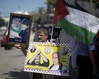 Palestinians for extending talks if inmates freed: poll
