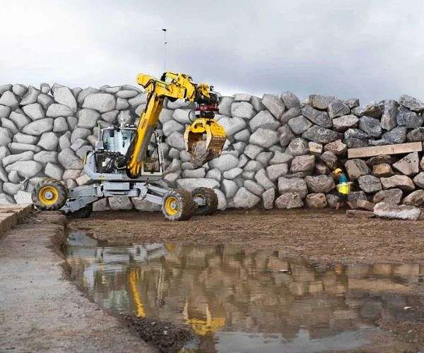Autonomous excavator creates 3D map of rocks to build 19-foot-tall wall