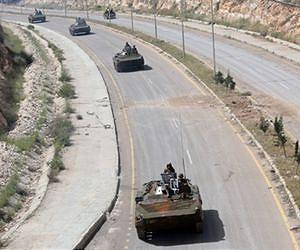Syria troops exit one protest hub, enter another