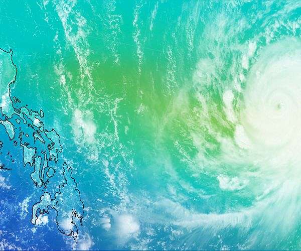 Hundreds flee floods as super typhoon brushes past Philippines