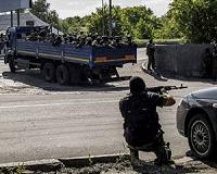 Ukraine, rebels give initial backing to small arms withdrawal