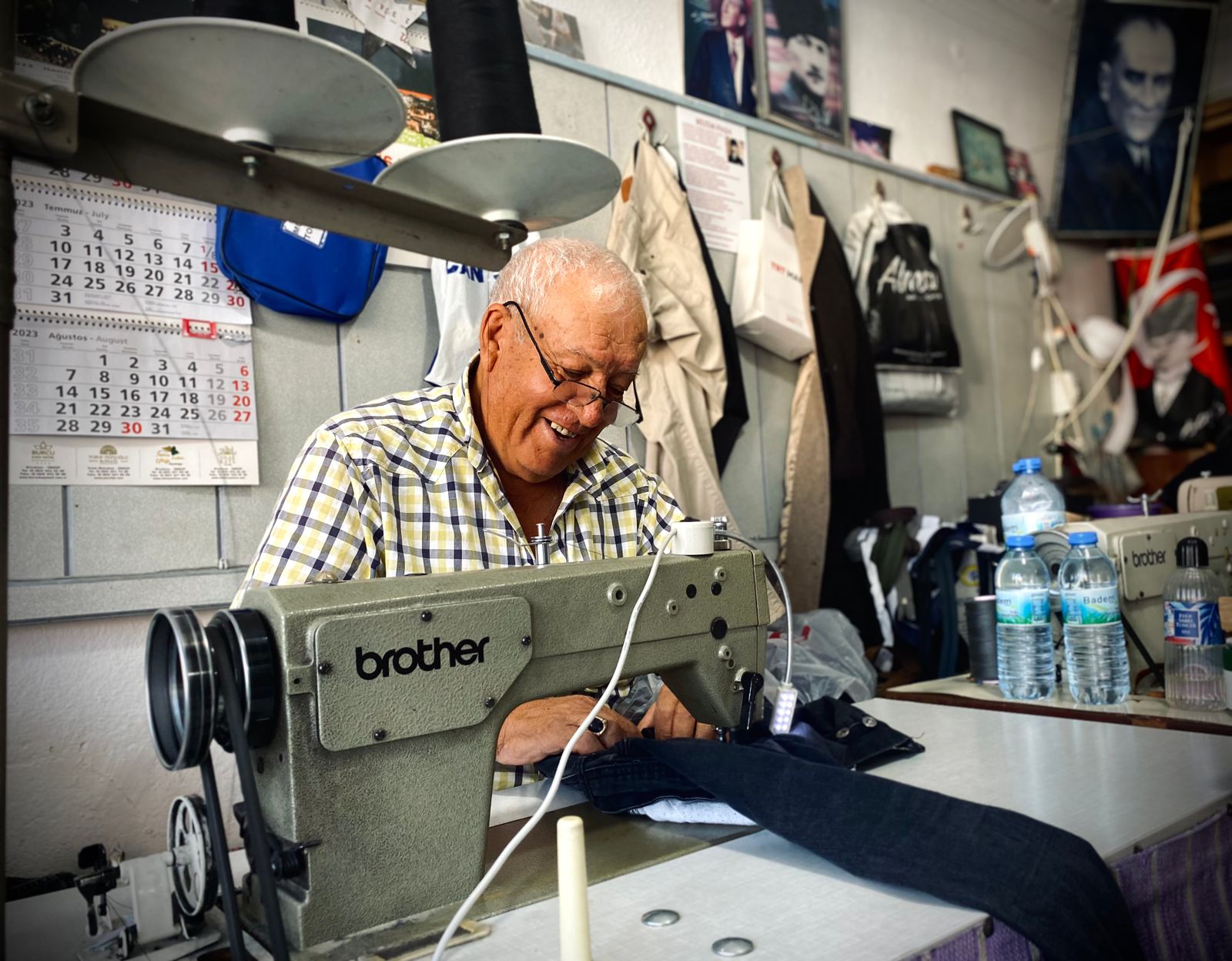older man mending jacket